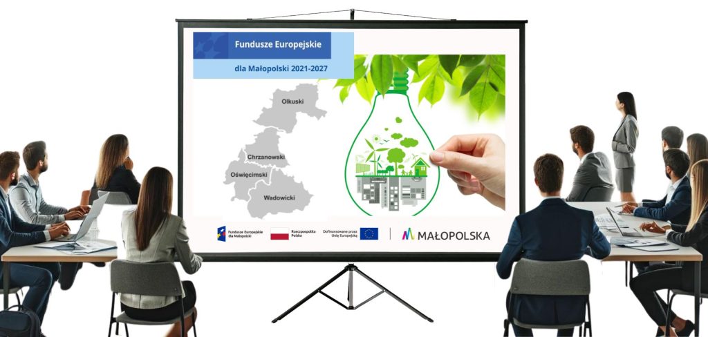 Grupa siedzących ludzi patrzących na ekran