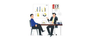 Dwóch mezczyzn siedzi przy biurku i pokazuja wykresy liczbowe